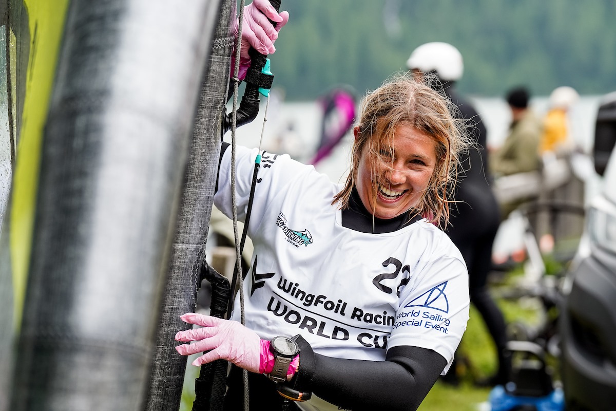 Julia Repschlager laughs as she shows off her new glove innovations